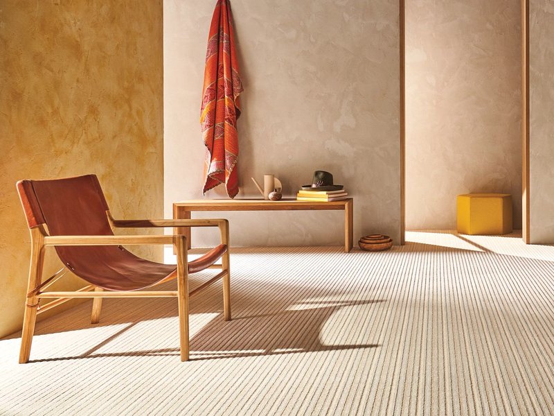 open concept room with sling chair and bench - Castillo's Carpet Shack in Riverside, CA