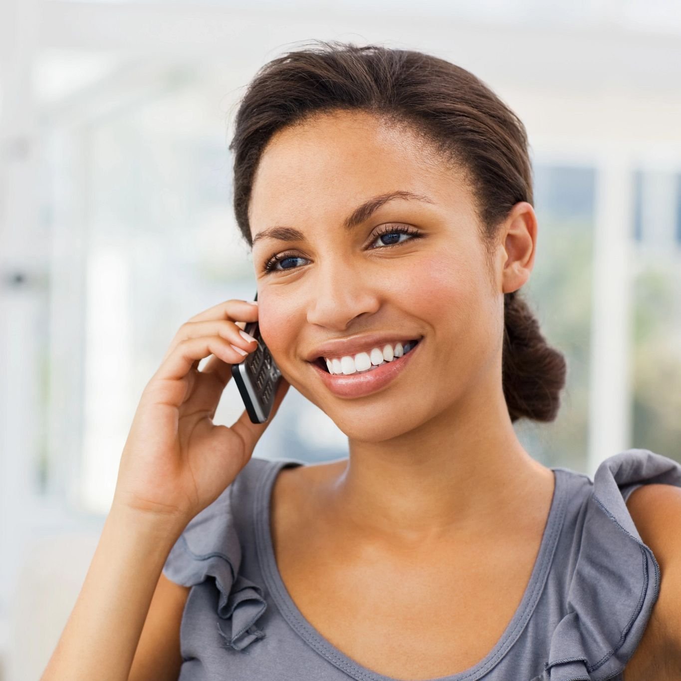 Woman on phone contacting Castillo's Carpet Shack